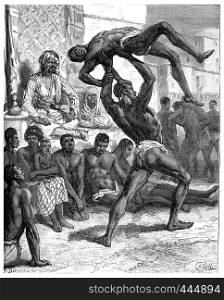Slavery in Sudan. The winner taken off his opponent at arm's length, vintage engraved illustration. Journal des Voyage, Travel Journal, (1880-81).