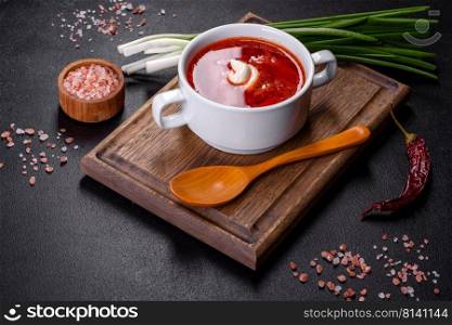 Slavic soup, Borsch, beet broth with vegetables and meat, Ukrainian soup. Borscht - traditional Ukraine soup made of beetroot, tomato, cabbage, carrot and beef
