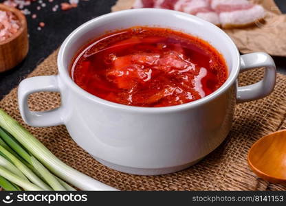 Slavic soup, Borsch, beet broth with vegetables and meat, Ukrainian soup. Borscht - traditional Ukraine soup made of beetroot, tomato, cabbage, carrot and beef