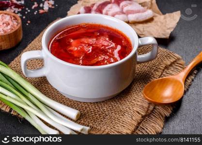 Slavic soup, Borsch, beet broth with vegetables and meat, Ukrainian soup. Borscht - traditional Ukraine soup made of beetroot, tomato, cabbage, carrot and beef