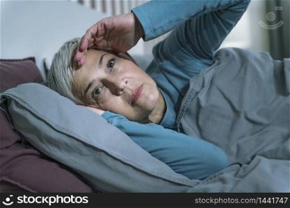Sleep Disorder. Worried Senior Woman Suffering from Insomnia, Having Headache, Touching her Forehead
