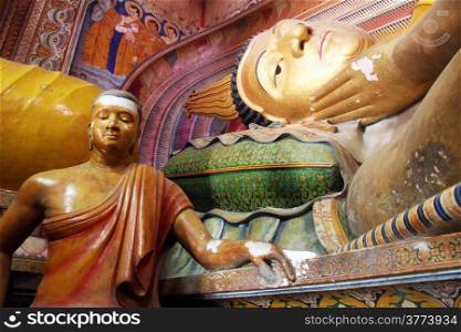 Sleeping Buddha and statues in Wewurukannala Vihara near Dikwella, Sri Lanka