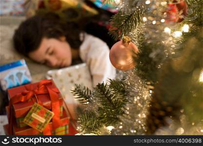 Sleeping girl and christmas gifts