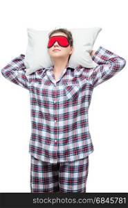 Sleeping woman on a pillow in plaid pajamas with a mask in front. Sleeping woman on a pillow in plaid pajamas with a mask in front of her eyes isolated