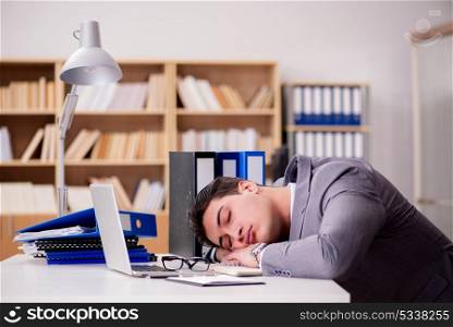 Sleepy businessman working in office