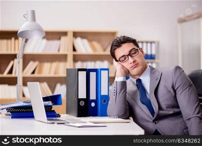 Sleepy businessman working in office
