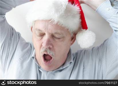 sleepy older man stretching and yawning
