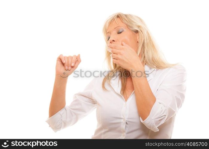 Sleepy tired mature business woman yawning covering her mouth with hand isolated on white