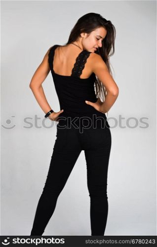Slender young Romanian woman dressed in black