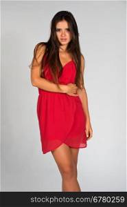 Slender young Romanian woman in a red dress