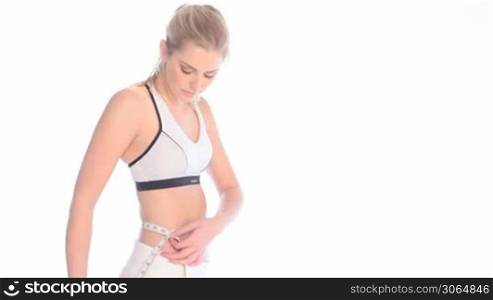 Slender Young Woman Measuring Waist