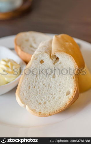 slice bread. close up slice of bread on white dish with delicious cheese