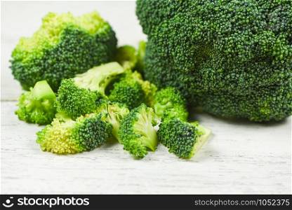 Slice Broccoli on white wooden Background / Vegetable healthy green organic raw broccoli florets ready for cooking food