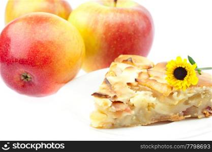 slice of apple pie apple and a flower isolated on white