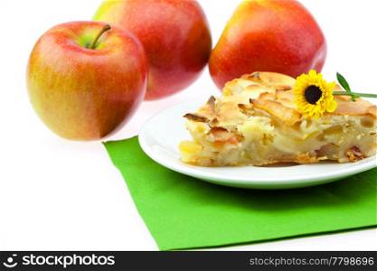 slice of apple pie apple and a flower isolated on white