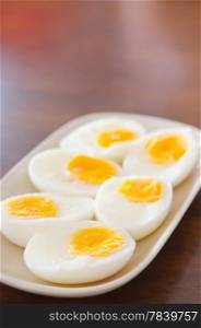 slice of boiled eggs on pink dish