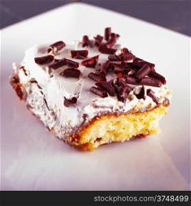Slice of cake with cream and chocolate