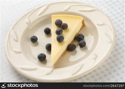 Slice of cheesecake with blueberries, close-up