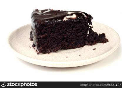 Slice of chocolate cake isolated on white
