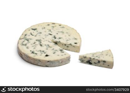 Slice of Fourme d&rsquo;Ambert cheese on white background