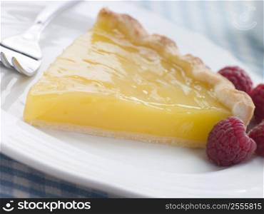 Slice of Lemon Curd Tart with English Raspberries
