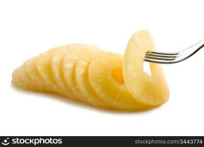 slice of pineapple on a fork isolated on white background