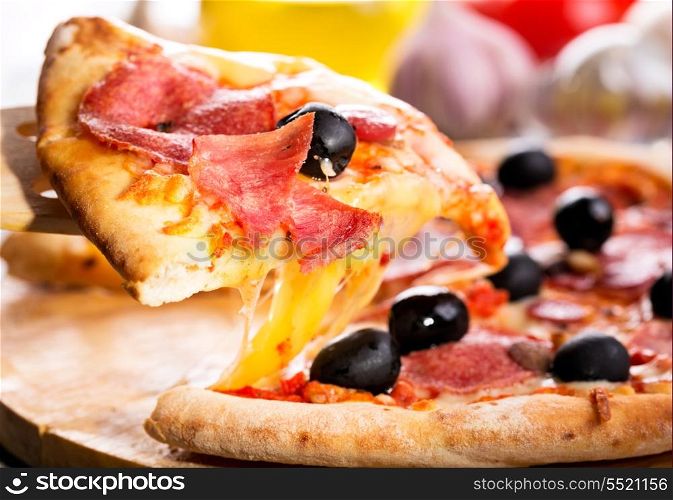 slice of pizza with bacon and salami