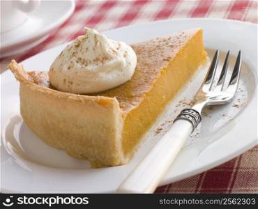 Slice Of Pumpkin Pie With Whipped Cream