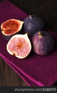 Slice of purple figs on background closeup