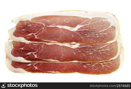 slice of raw ham in front of white background