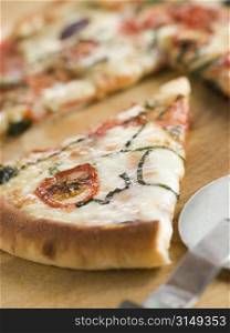 Slice of Tomato Mozzarella Aubergine and Basil Pizza