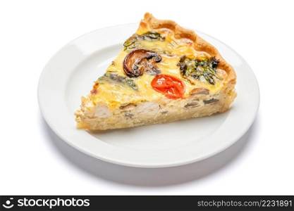 Slice of traditonal homemade spinach chicken quiche tart or pie on plate isolated. Slice of traditonal homemade spinach chicken quiche tart or pie on plate