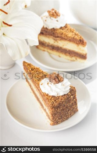 Slice of walnut cake in a white plate