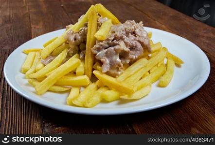 Slice pork and french fries. close up