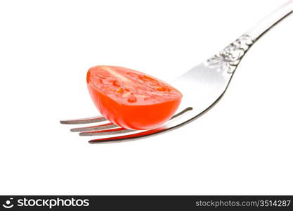 slice tomatoes on a fork isolated on white background