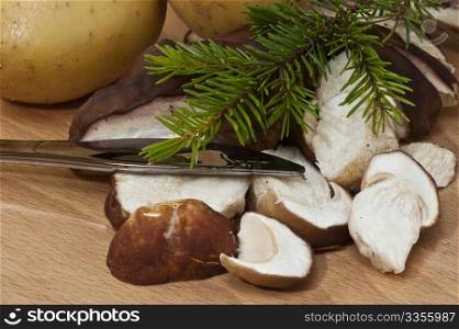sliced a??a??mushrooms on wooden cutting board