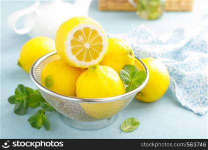 Sliced and whole lemons with mint