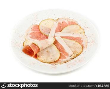 Sliced bacon with sliced pear decorated isolated on a white