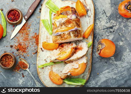 Sliced baked pork with on cutting board. Roasted sliced pork