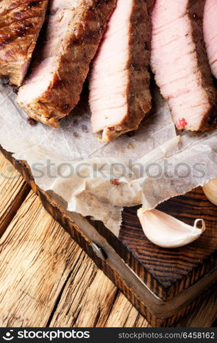 Sliced beef steak. Grilled sliced beef steak on cutting board.Juicy steak