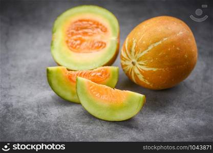 Sliced cantaloupe thai tropical fruit asian on dark background / Cantaloupe Melon Muskmelon Cucurbitaceae