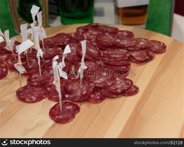 Sliced Cold Cuts with Toothpicks on Wooden Board, Salami