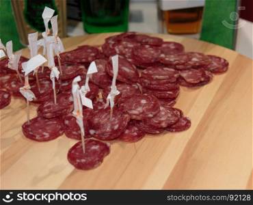 Sliced Cold Cuts with Toothpicks on Wooden Board, Salami