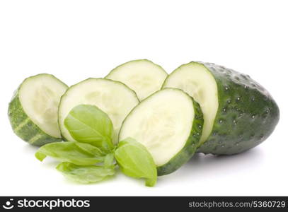 Sliced cucumber vegetable and basil leaves still life isolated on white background cutout