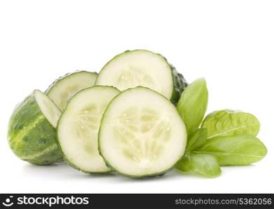 Sliced cucumber vegetable and basil leaves still life isolated on white background cutout