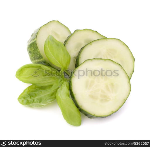 Sliced cucumber vegetable and basil leaves still life isolated on white background cutout