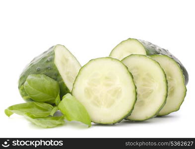 Sliced cucumber vegetable and basil leaves still life isolated on white background cutout