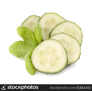 Sliced cucumber vegetable and basil leaves still life isolated on white background cutout