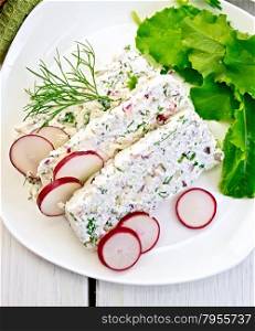 Sliced curd terrine with dill and radishes, green onions, salad on a plate, napkin on a light wooden planks on top