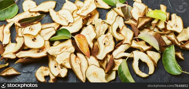Sliced dried pear pieces.Dried pear or pear chips.Dried fruits. Dry pear fruit